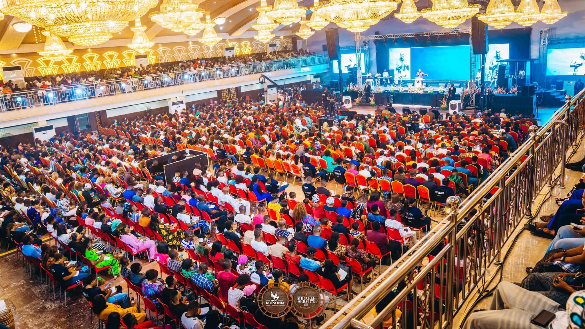 A large Koinonia congregation gathered together during a ministry service.